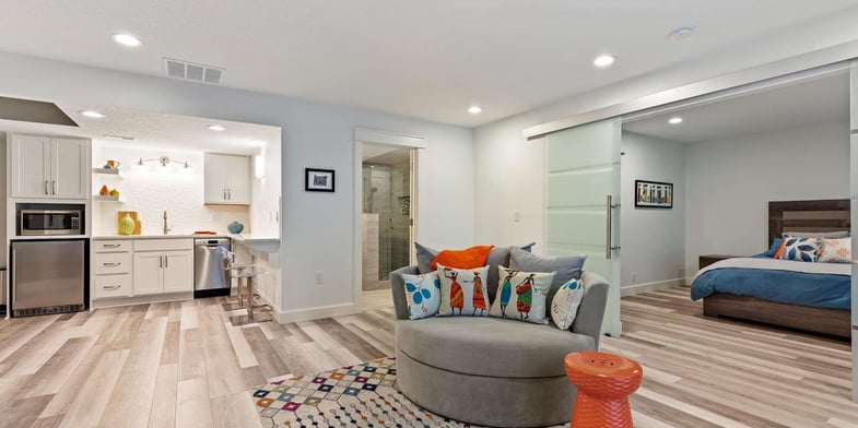Finished Portland basement in-law suite with a kitchenette, sitting area, bathroom, and bedroom.