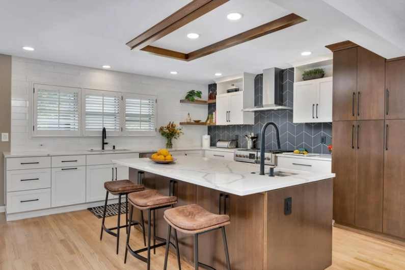 Kitchen remodel in Portland, OR by Creekstone Design and Remodel featuring quartz island, custom cabinets, and open layout