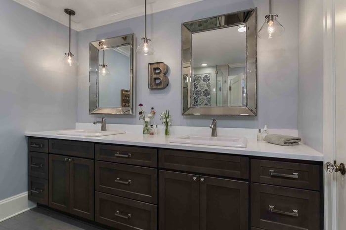 Primary bathroom in Portland, OR featuring dual-sink vanity with dark cabinetry