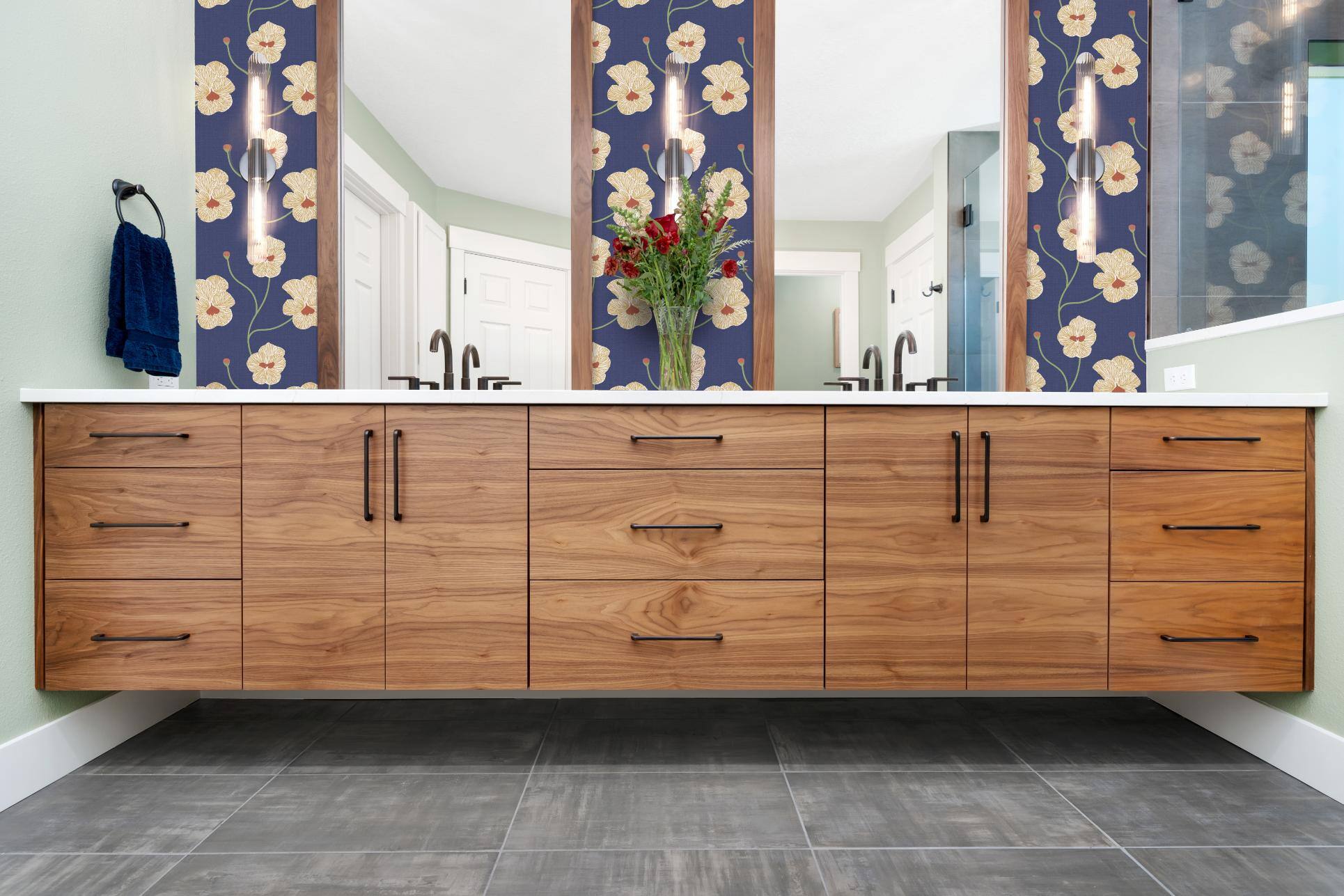 Remodeled bathroom with floral wallpaper and floating vanity in Forest Grove, OR by Creekstone Design + Remodel