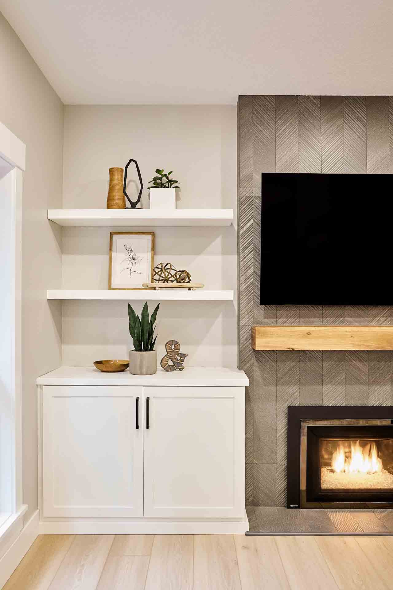 Custom living room in Portland, OR featuring fireplace and built-in storage