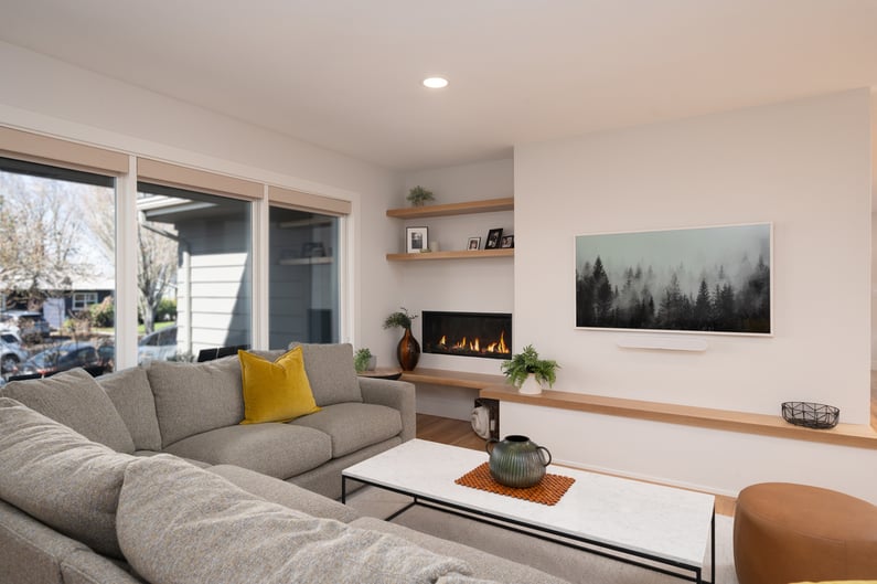 Contemporary living area with natural lighting and built-in fireplace in Hillsdale, OR by Creekstone Design + Remodel