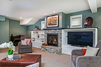 Stacked-Stone-Fireplace-Surround-with-Custom-Dark-Wood-Mantel-and-Built-in-Shelving-and-TV-Nook-1-768x512