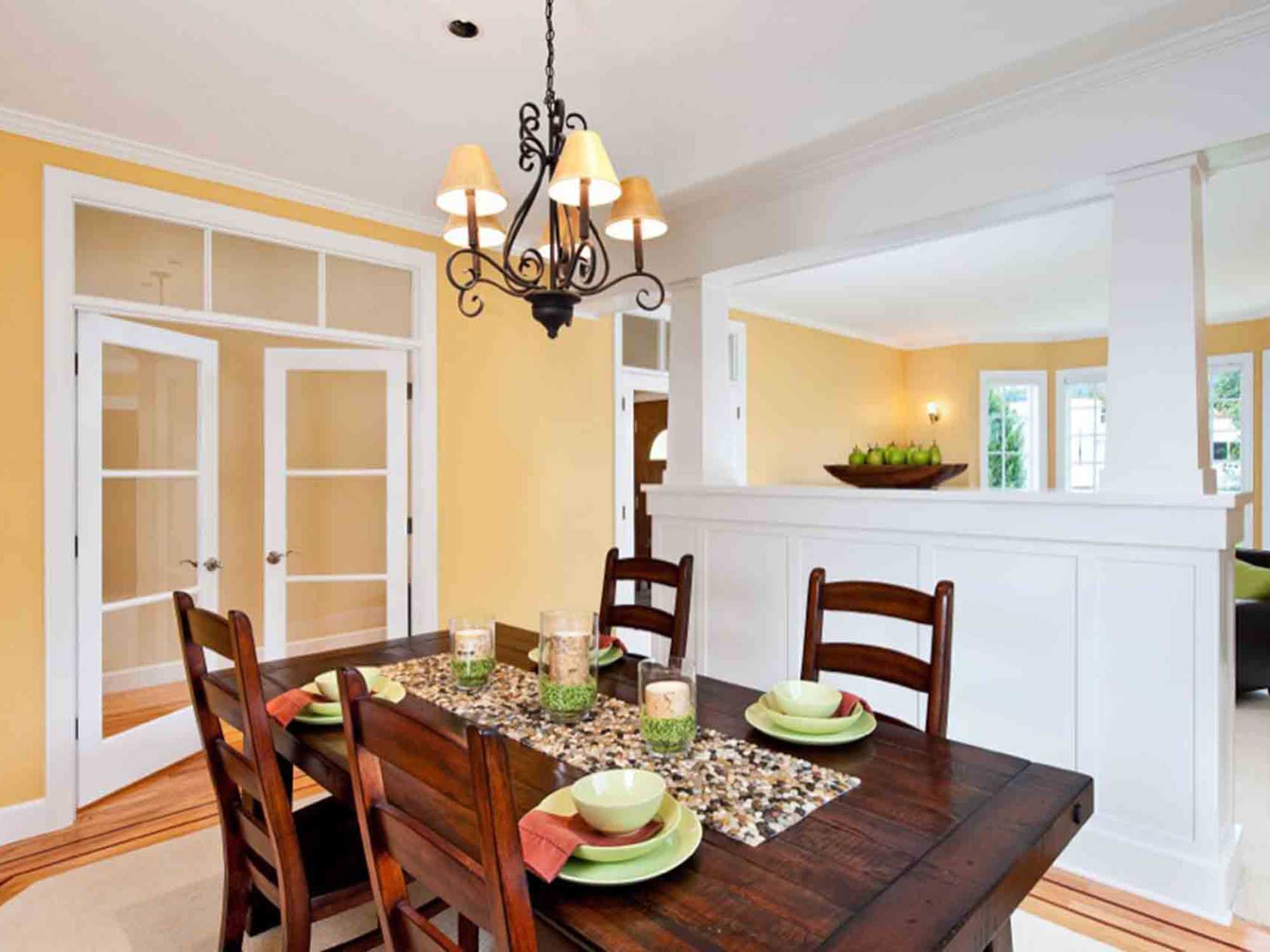 Image of a remodeled Portland Dining and Living Room with kitchen-style table by Creekstone Design and Remodel