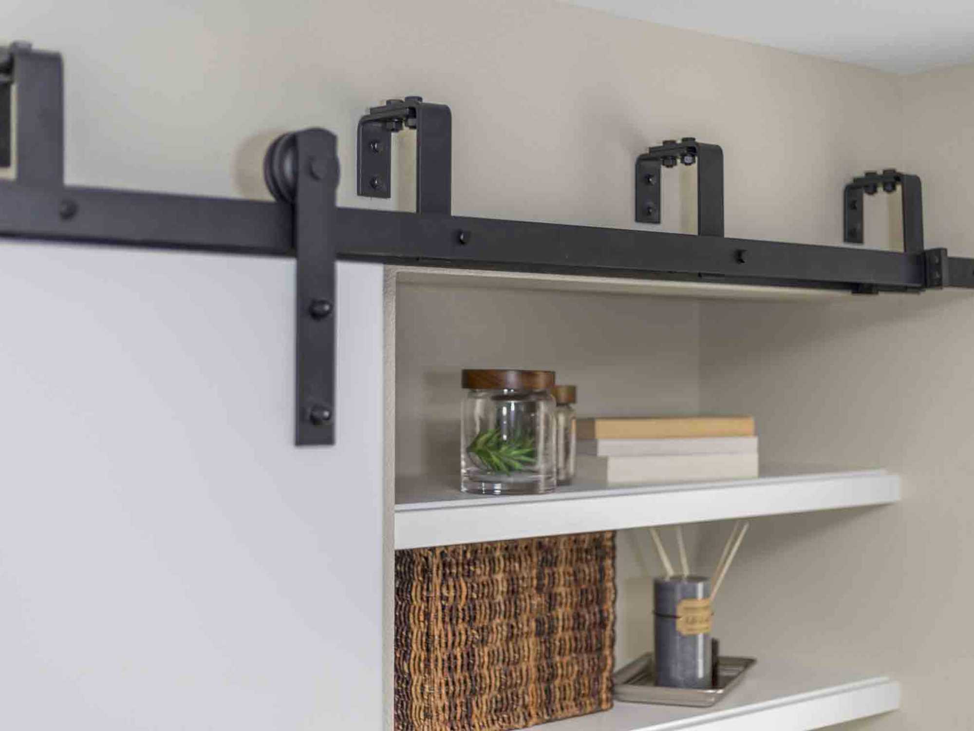 Image of a sliding door in a Bonus Room in a Home Addition with custom shelving by Creekstone in Portland, OR