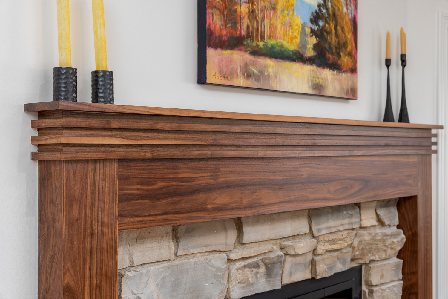 Close-up of a custom-built wood fireplace mantel with detailed craftsmanship, part of a whole home remodel in Portland, OR by Creekstone Design + Remodel