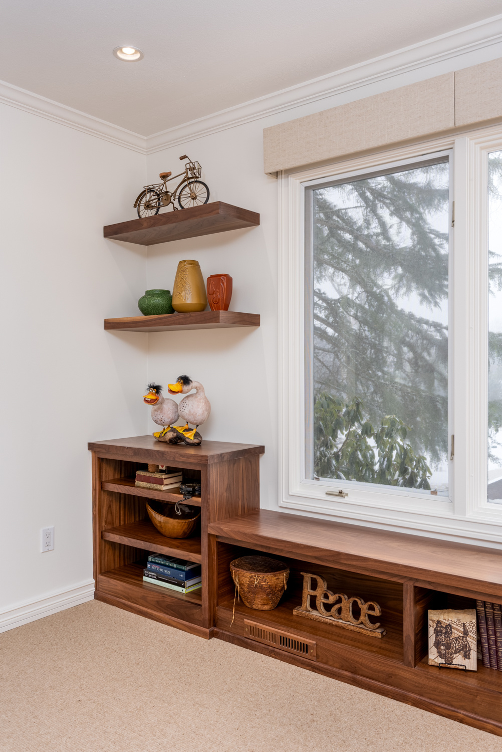 Corner shelving unit with a mix of contemporary and rustic decor, part of a whole home remodel in Portland, OR by Creekstone Design + Remodel