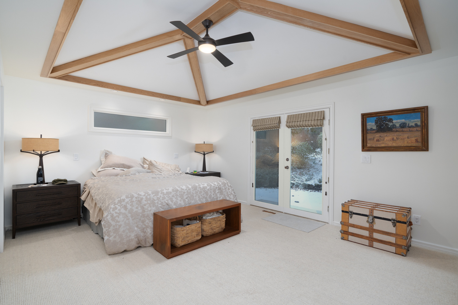 Modern bedroom with a cozy, tranquil ambiance, wood elements, and a well-balanced color palette, featured in a whole home remodel in Portland, OR by Creekstone Design + Remodel