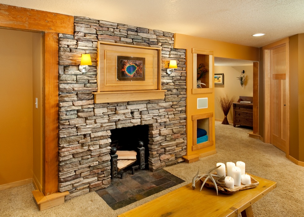 Contemporary basement remodel with natural rock fireplace Contemporary basement remodel with natural rock fireplace