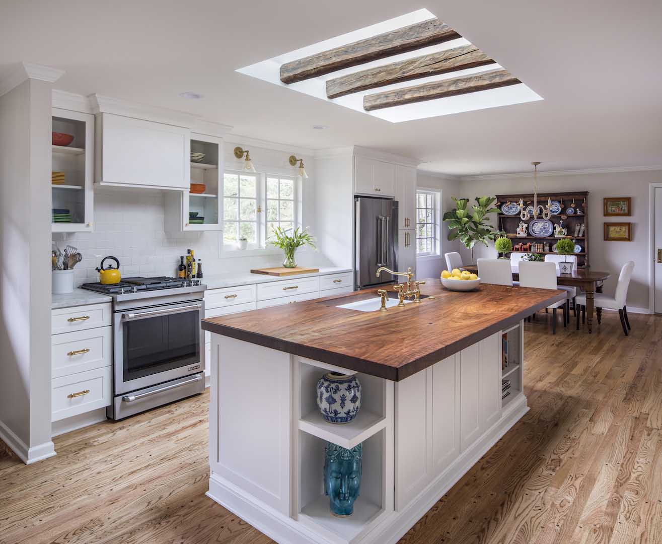 Kitchen island with walnut countertop and open shelving