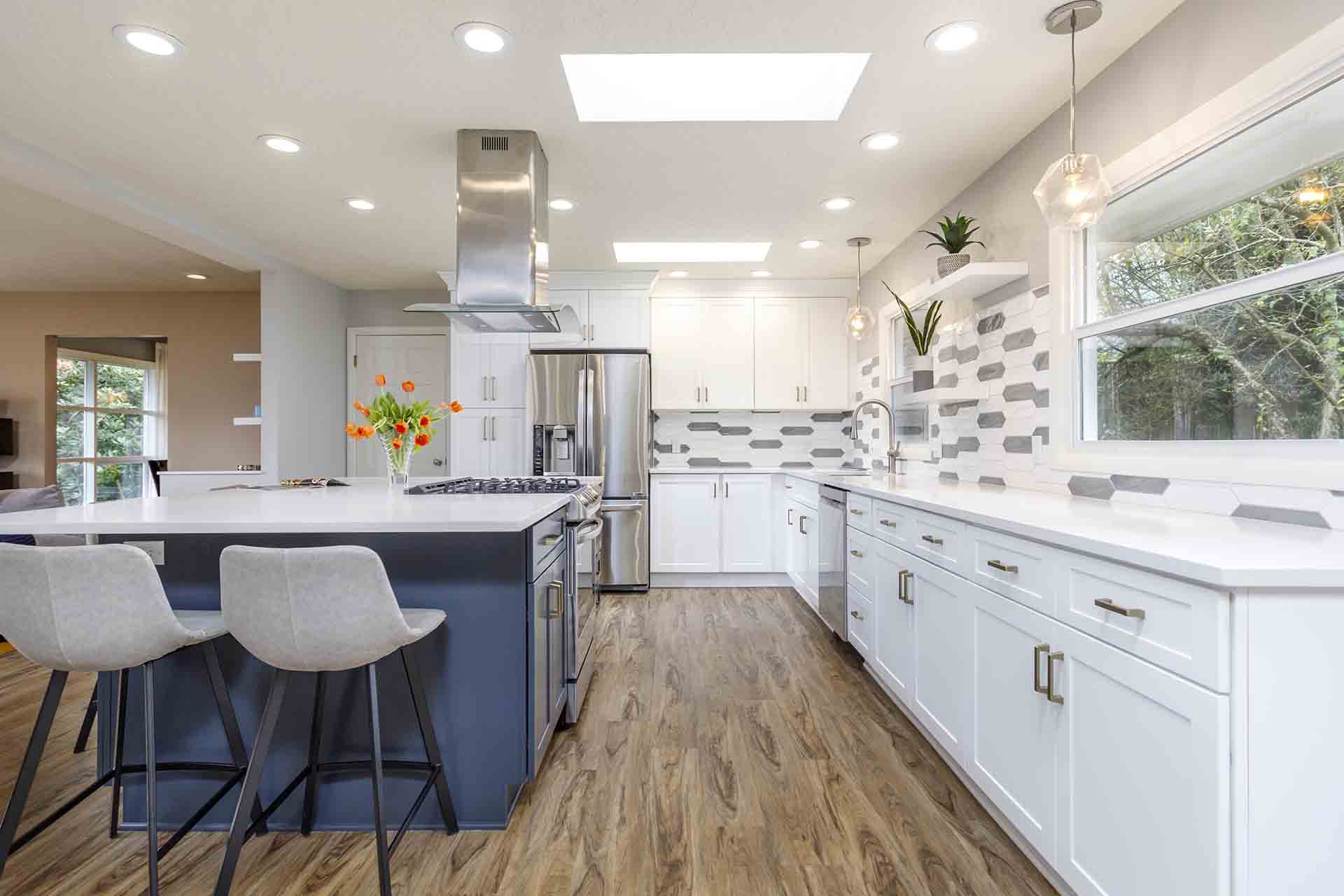 Lengthwise view of kitchen and two toned cabinets