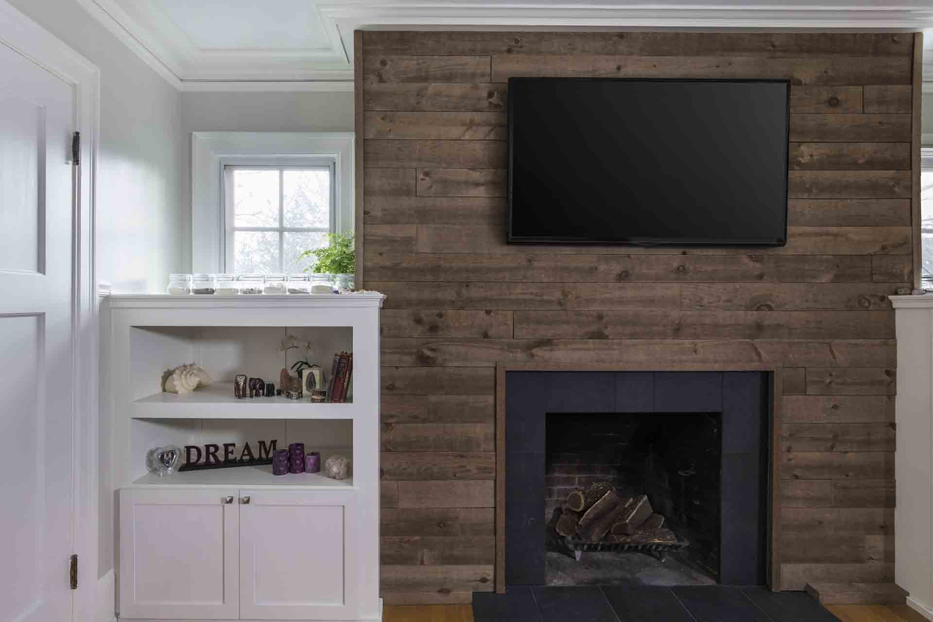 wood fireplace surround with custom cabinet