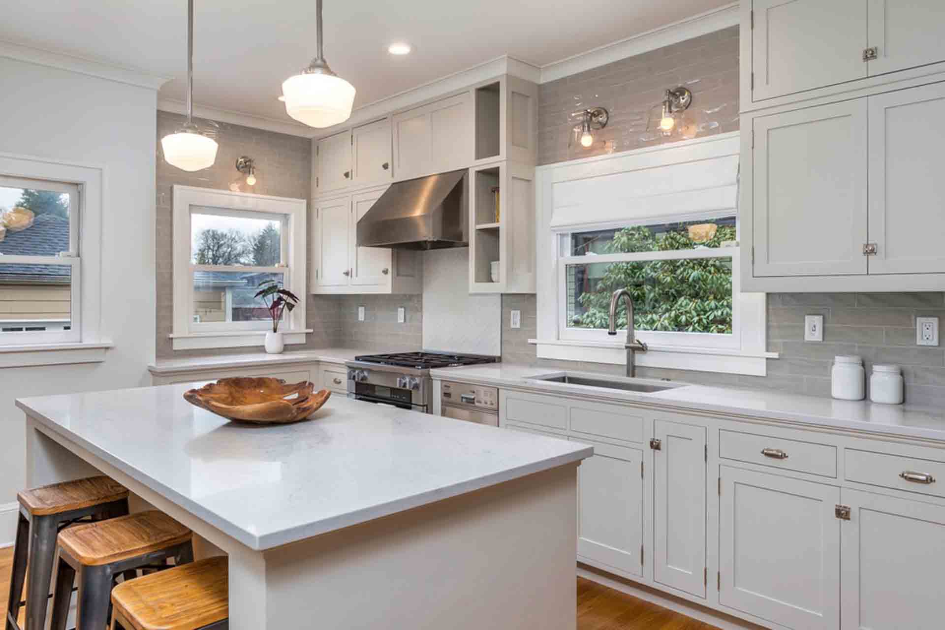 kithcen island and sink with white cabinets