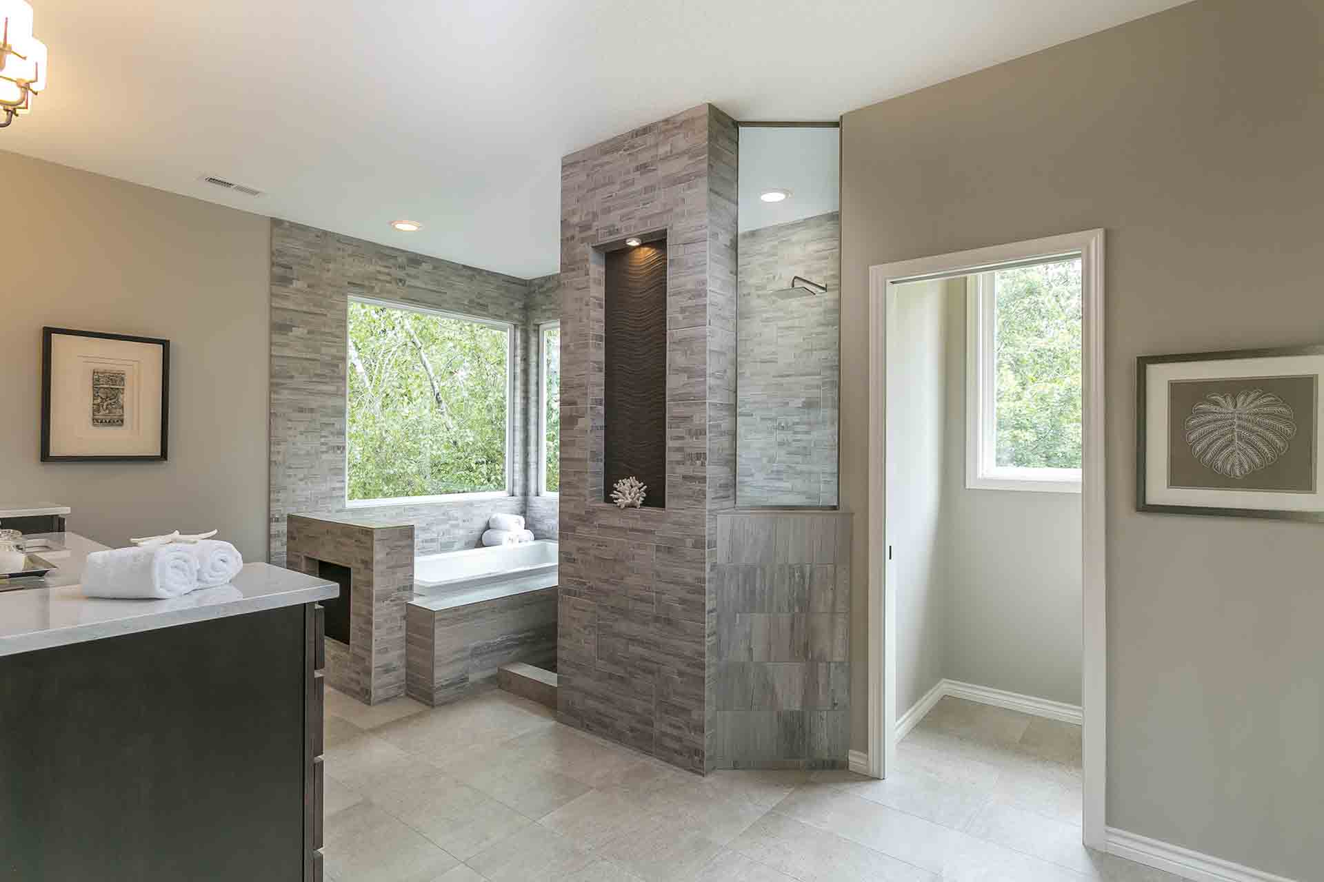 bathroom with water closet, big standing shower and tub