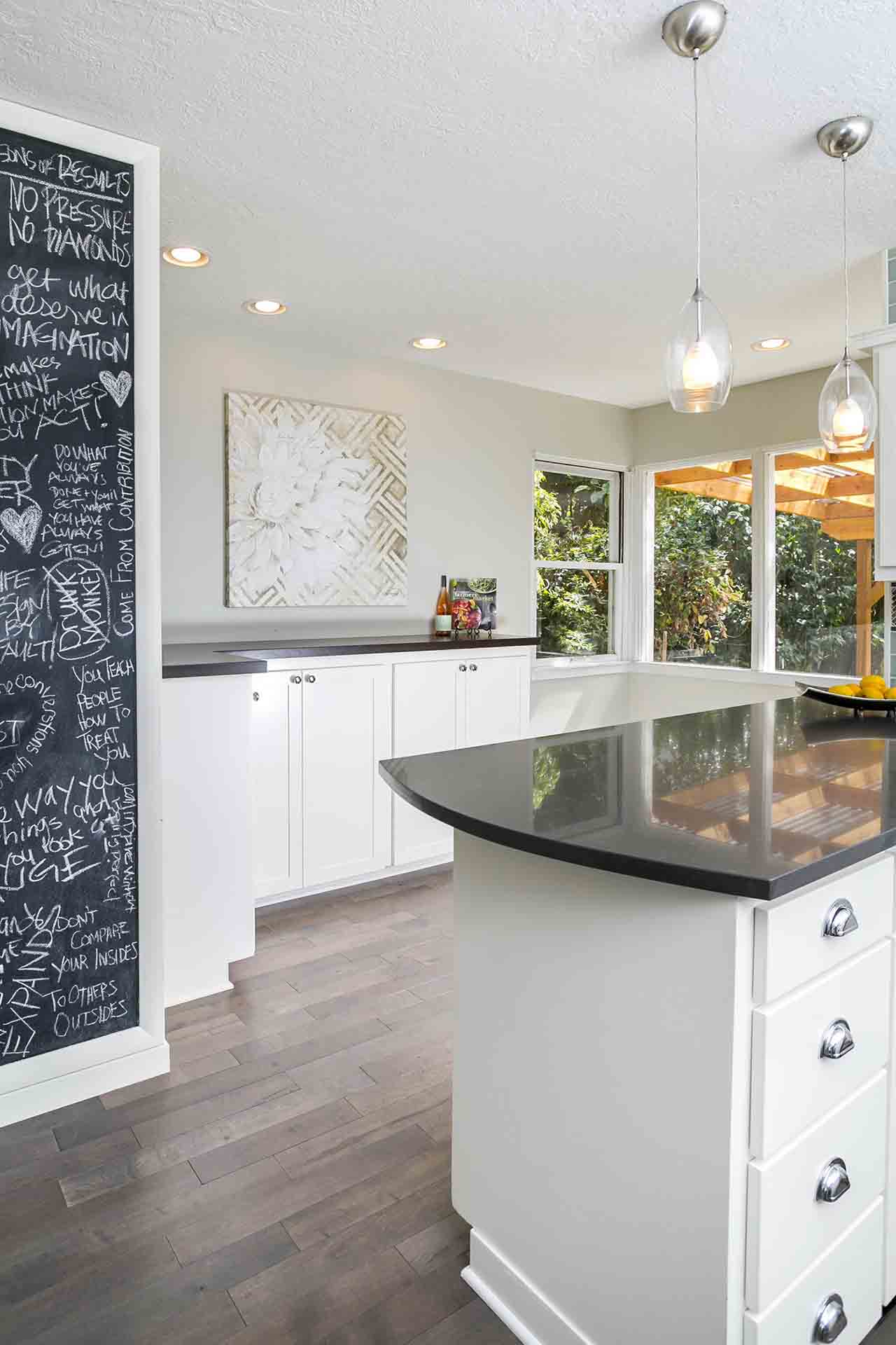 kitchen peninsula and chalk board wall