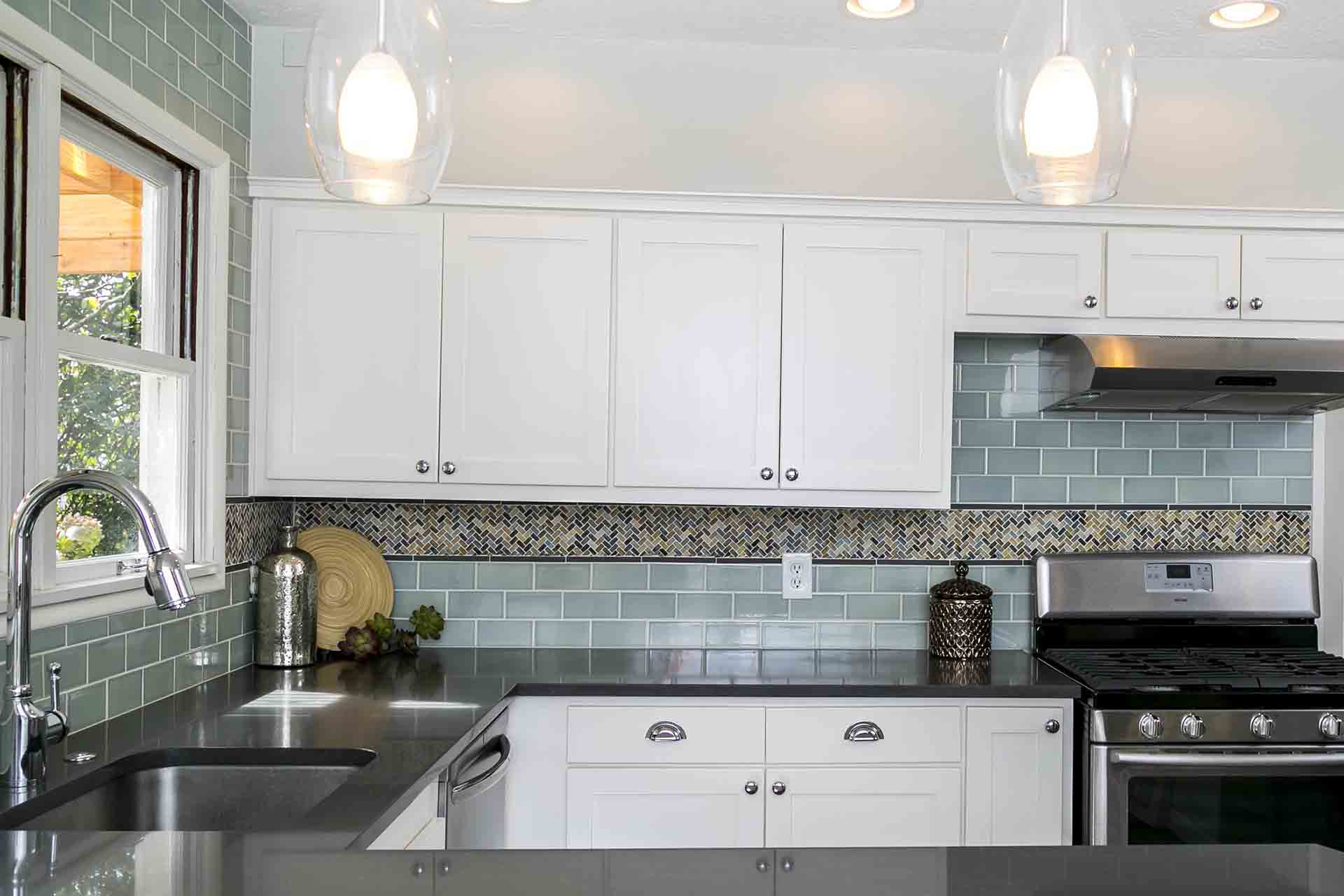 Kitchen counter with white upper cabinets