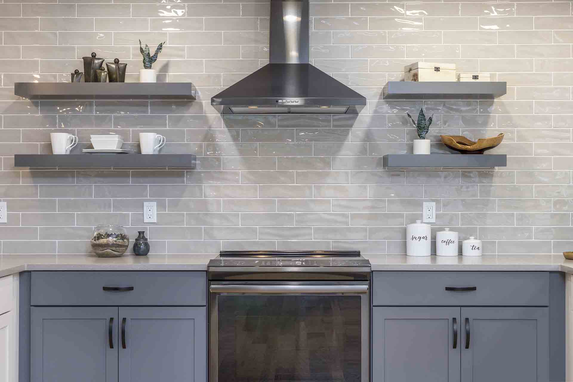 Stove, hood and floating shelves with backsplash