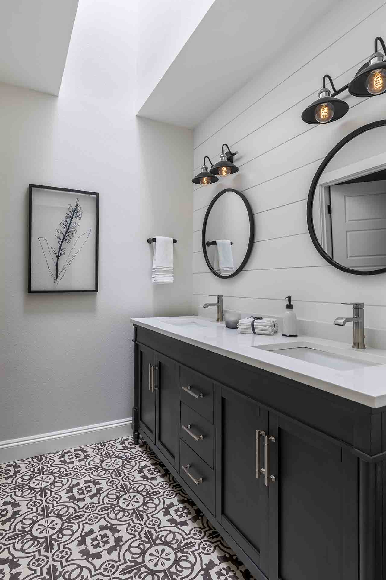 guest bathroom vanity with intricate tile work